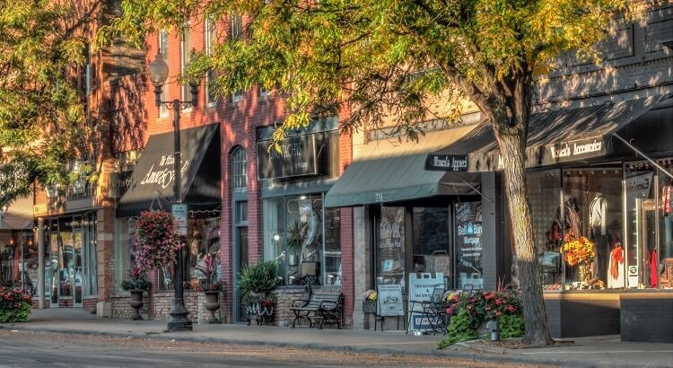 Historic brick storefronts on Water Street in downtown Excelsior on a summer afternoon